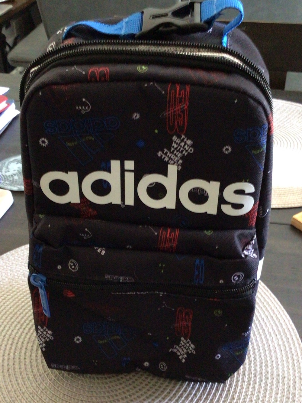 adidas Black lunch box with Blue and Red Accents